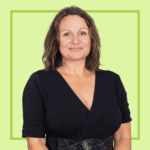 Light green background with image of Dr Nancy Doyle wearing a blue blouse, smiling at the camera.