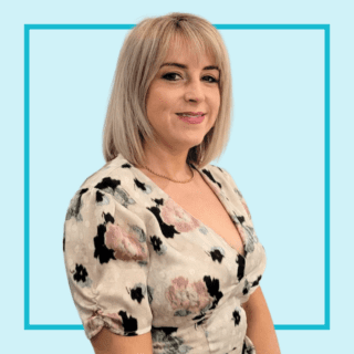 Light blue background with image of Nicola Maguire-Alcock, wearing a pattern top and smiling at the camera.