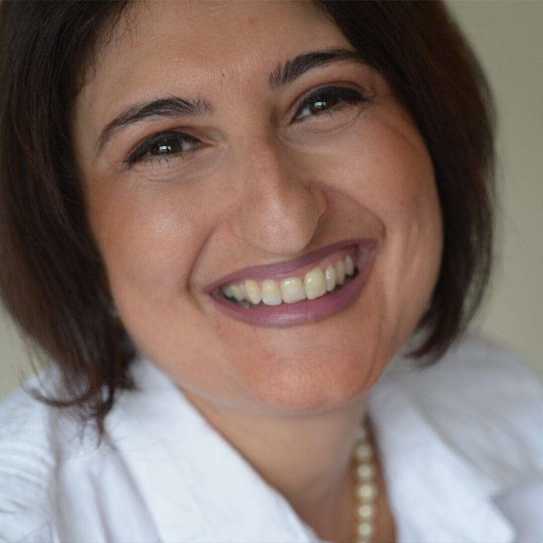 Profile picture of Rukshana Horwood, smiling and wearing a white shirt.