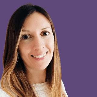 Image of Stephanie Benfield smiling at the camera wearing a white top