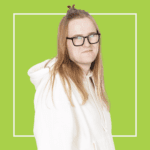 Green background with image of Joe Dugdale in a white hoodie and glasses, smiling at the camera