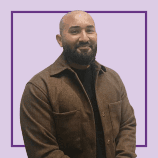 Light purple background with image of Mo Ali, stood against a purple background, smiling at the camera and wearing a brown jacket and black tshirt