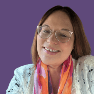 Purple background with image of Tamzin Hall, smiling at the camera